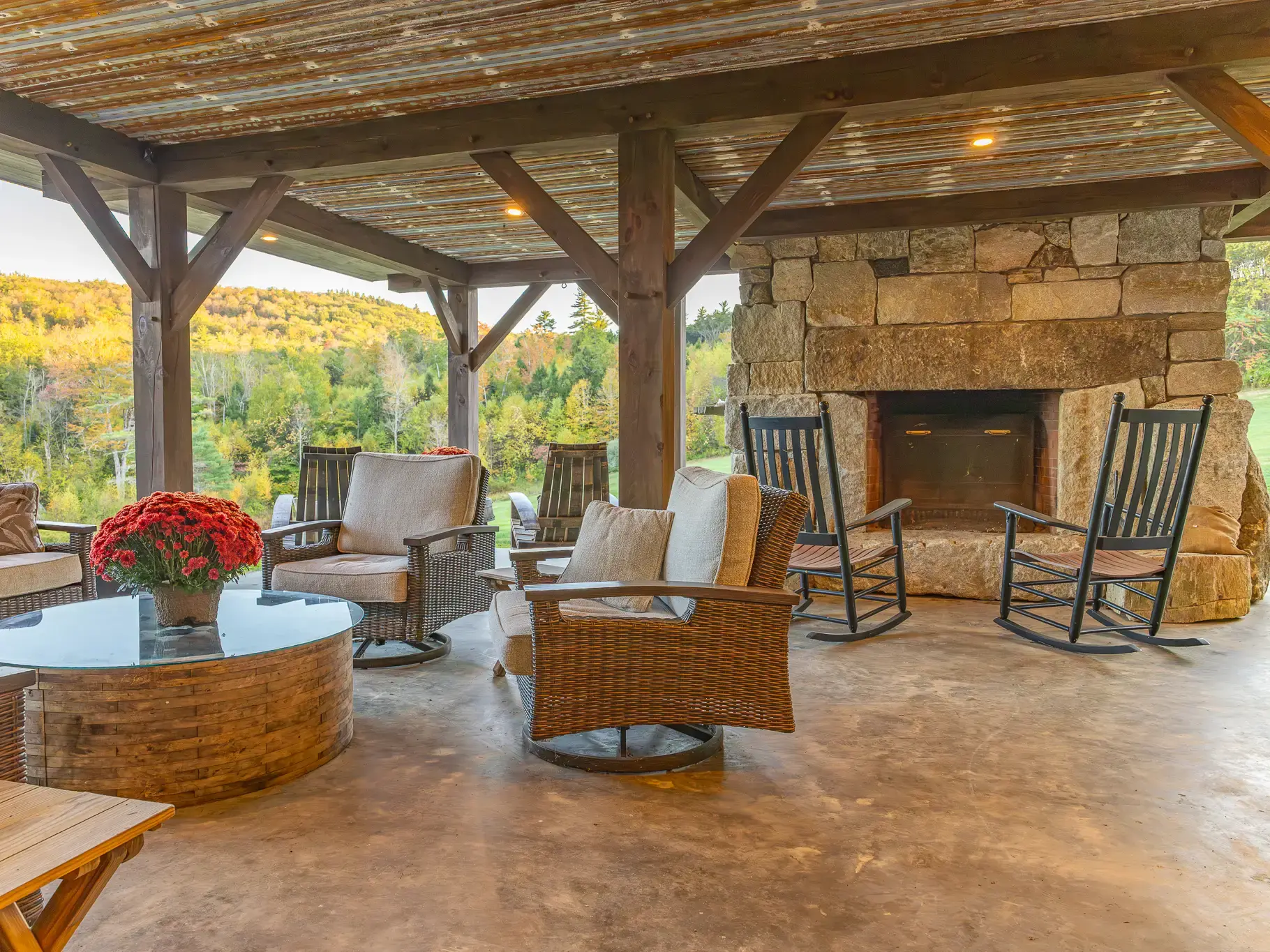 Covered porch with stone fireplace
